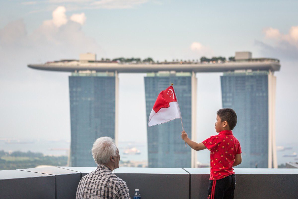 mindefsg's tweet image. A “lucky shot” for photo enthusiast Ahmad Iskandar turned out to be the winning capture of this year’s #WeAreTotalDefence Photo Challenge: a rain-puddle reflection of #Singapore&apos;s community spirit. 
More on the top 3 winning entries: mindef.sg/tdphoto18