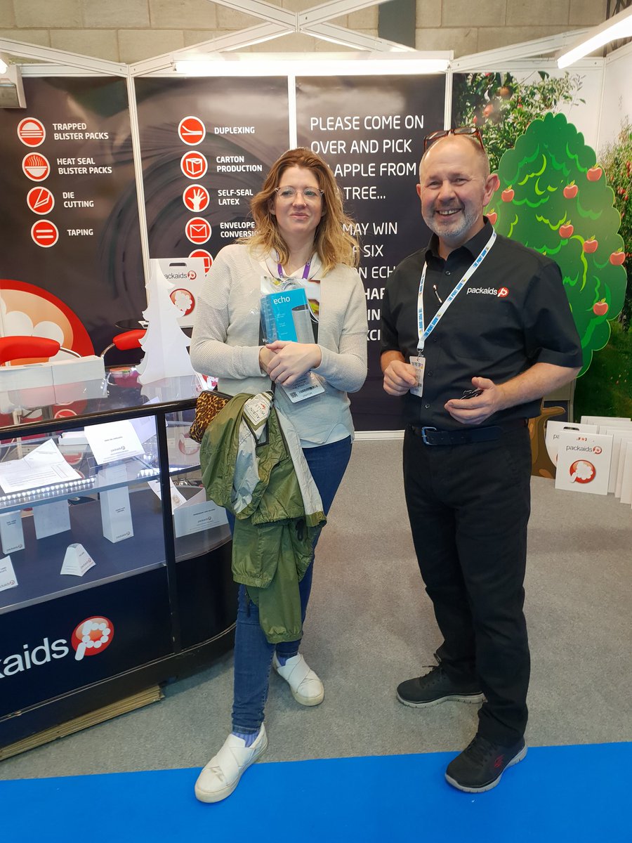 Packaids's tweet photo. Congratulations Kate from @yveprintco on winning an Amazon Echo by picking a peel &amp; reveal apple from our tree! #theprintshow https://t.co/Ga4GGBdpBF