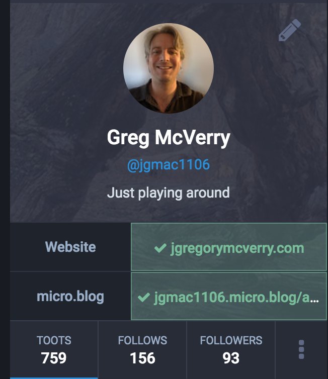 Cropped screenshot of Greg McVerry’s Mastodon profile showing website fields with their domain and micro.blog profile with green checkmarks next to each indicating they’ve been verified