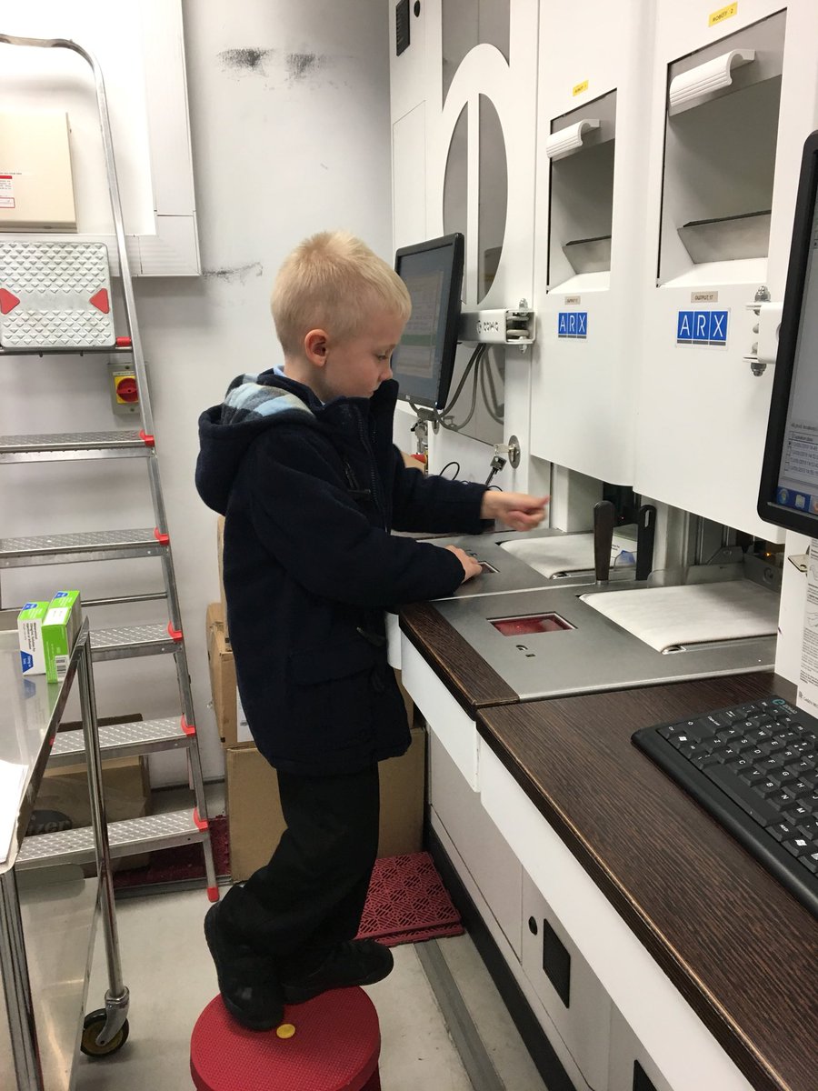 @MissSmith_Yr2 Oliver had a Hospital app after school so we popped into my work after. He was fascinated by the robot and got to work feeding medicines into it. #CareerInPharmacy