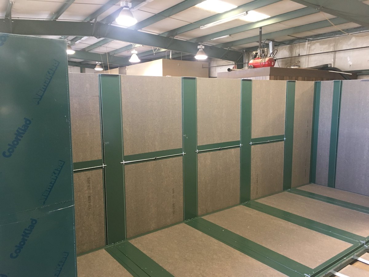 Staging large green custom enclosure.  Ready to ship within two weeks.
