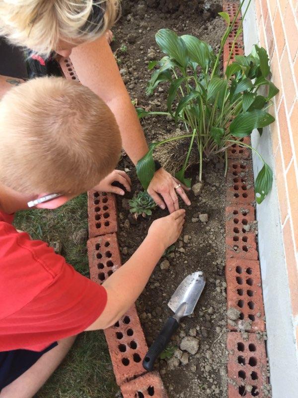 FalconsMD's tweet photo. Planting flowers... Tie dyed shirts... Busy day!! #kizerskrew #ghspride https://t.co/au0yhkjsb5