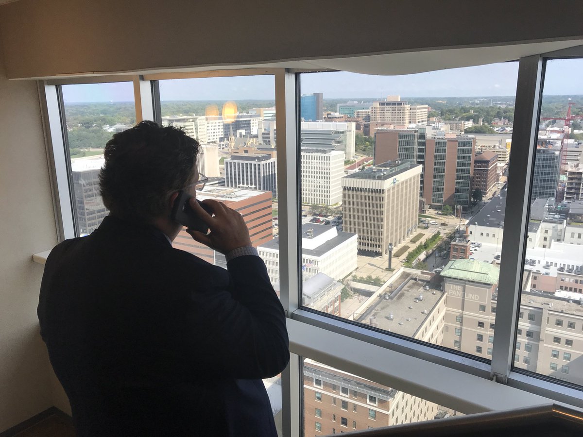 mattbach's tweet photo. @DPGilmartin doing live interview right now on @wjr with #GuyGordon about #municipalfinance @SaveMICity. Dan is talking from his cellphone while overlooking @grandrapidscity at #GrandRapids18 #mmlconf @aminghine #SaveMiCity https://t.co/0i68H0ByDY
