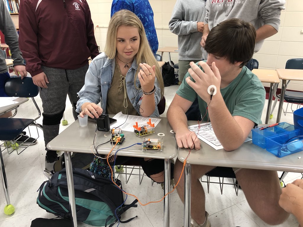 cobracrew's tweet photo. Always figure out a way to use our backyard brains equipment! Neuroprosthetics anyone? He moves his arm and makes hers move too! @GHSCareerTech #physicalscience @GuntersvilleHS https://t.co/V3CKQQ6Th1
