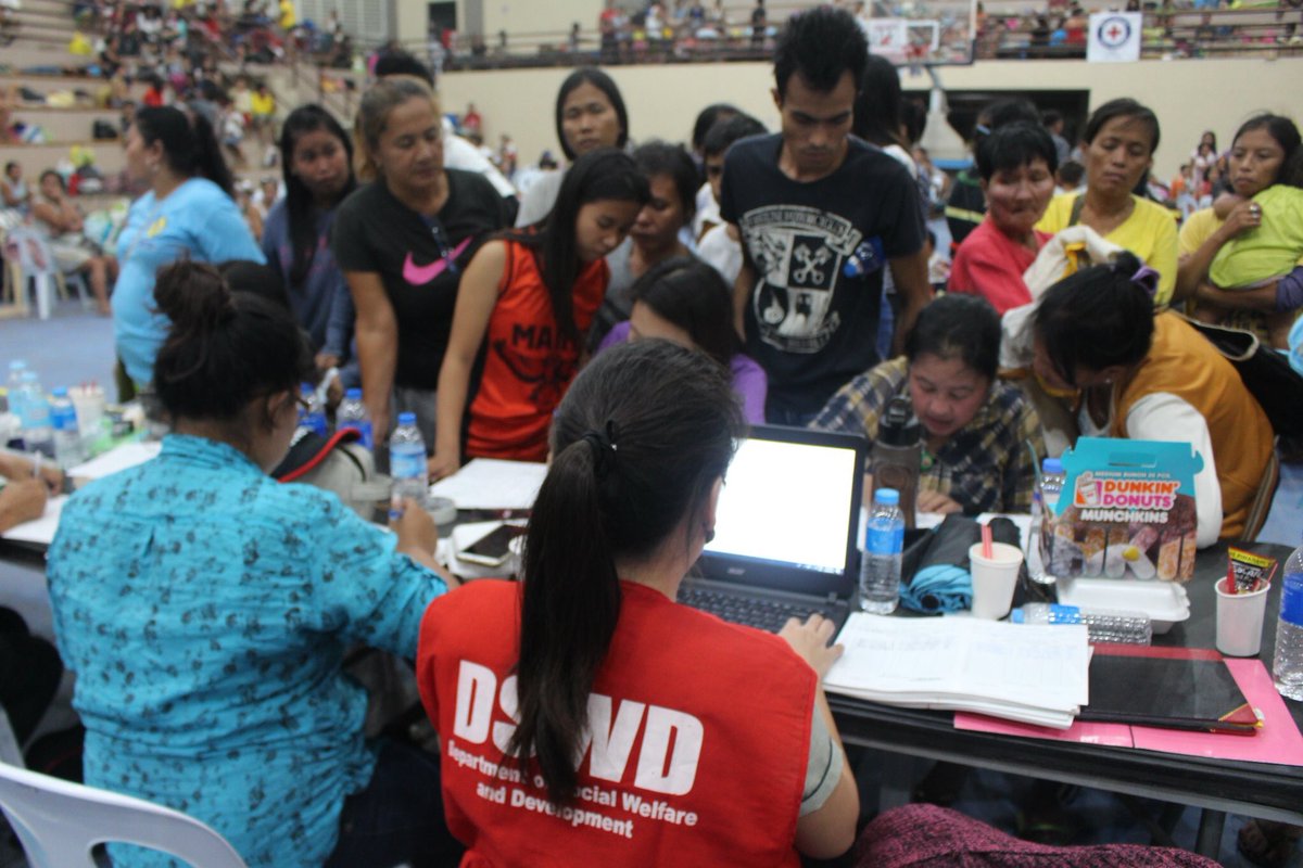 PHNews01's tweet photo. DSWD-7 staff and the staff from the City Social Welfare and Development Office (CSWDO) of Naga City, Cebu work together in profiling &amp; encoding the Disaster Assistance Family Access Card for those who have been affected by the landslide.

#DSWDInAction
#DuterteImpact

(c) DSWD-PH https://t.co/Vgip0iqrLx