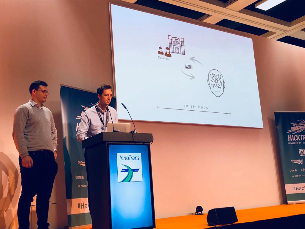hackpartners's tweet image. Alex Hudson leads the next pitch as part of team Crack-it. Alex introduces their use of AI, clustering and deep learning to detect building cracks as part of @networkrail 's challenge! #HackTrainIT #InnoTrans2018 @InnoTrans