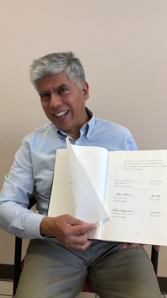 AmFamJustin's tweet photo. We have a lot of smart people in #D357. One of those is agent Nicolas Zavala. I just had to share this picture of him with the dissertation that he wrote for his PhD. It is a very thick book. His love for learning is inspiring. #RelearnHowToLearn @amfam #LongLiveDreams https://t.co/CwcO244KxX