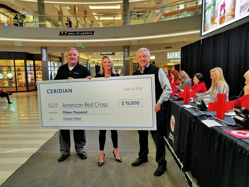 HRsuccess101's tweet photo. Today, Ceridian Chief People and Culture Officer, Lisa Sterling, presented the American Red Cross with a donation for #HurricaneFlorence relief on behalf of Ceridian. Thank you to the Red Cross for all of the admirable work that you do. https://t.co/a3meUNc5WA