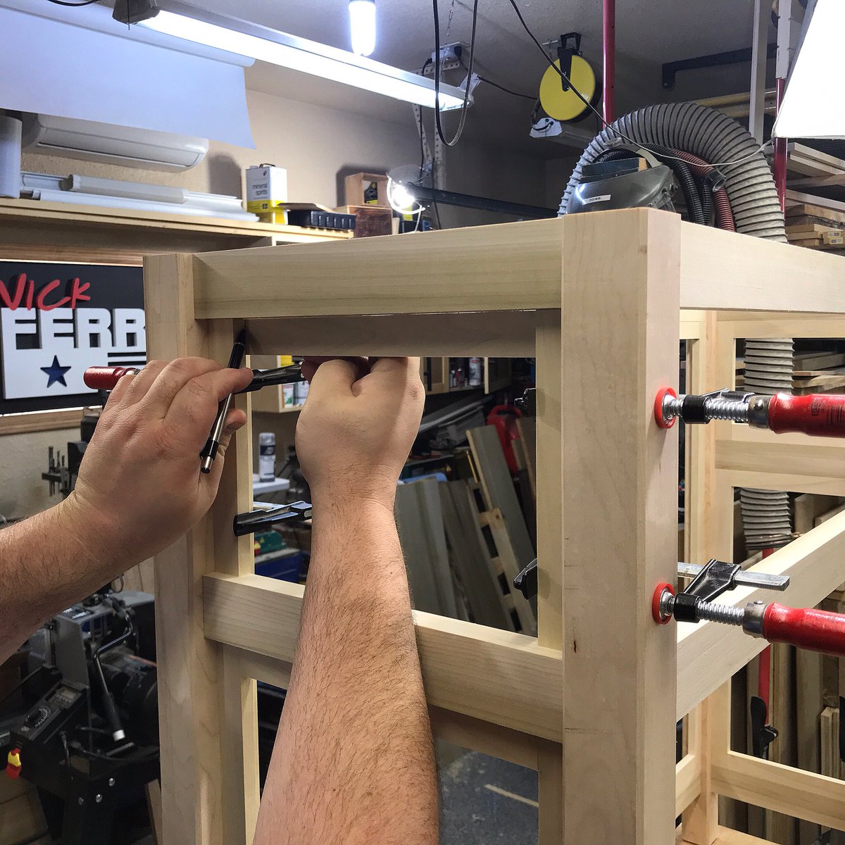 NickFerryBuilds's tweet photo. Installing the last panel trim piece on my gaming cabinet - this end of the cabinet is going to have some really cool features - #gamingtvliftcabinet #woodtrim #cabinetmaking #nickferry https://t.co/5LeJFVXHnn