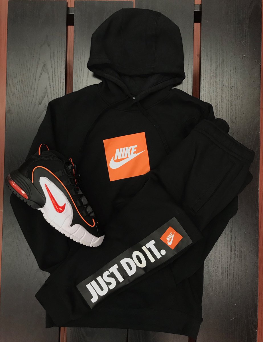 black nike hoodie with orange square