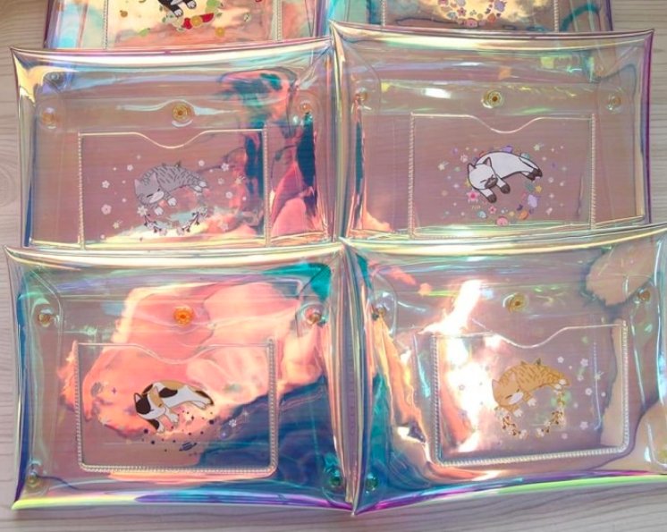 getmeds's tweet photo. Quick question: should we add these holographic clutches to the order? https://t.co/UZ2ym7zvQi