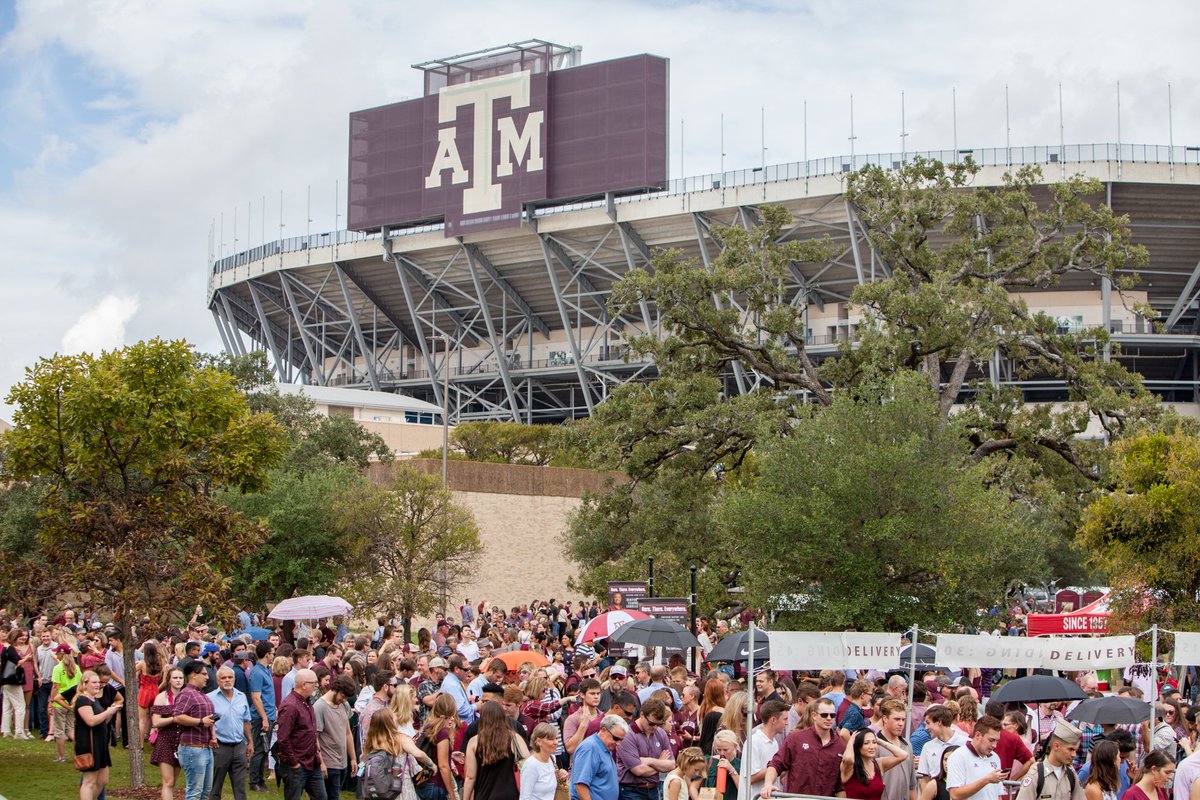 lines of aggies waiting between kyle field and the alumni building