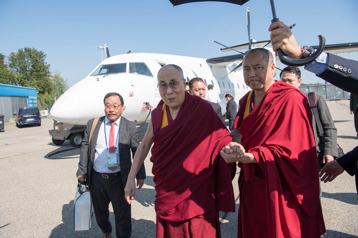 IndyHack's tweet image. According to my source in the Dalai Lama's inner circle their official photo of his arrival at Zurich airport shows a plane he didn't travel on. The one in the background was preparing for takeoff from Execujet. He arrived on a small private jet shown here in the UK.
#DalaiLama