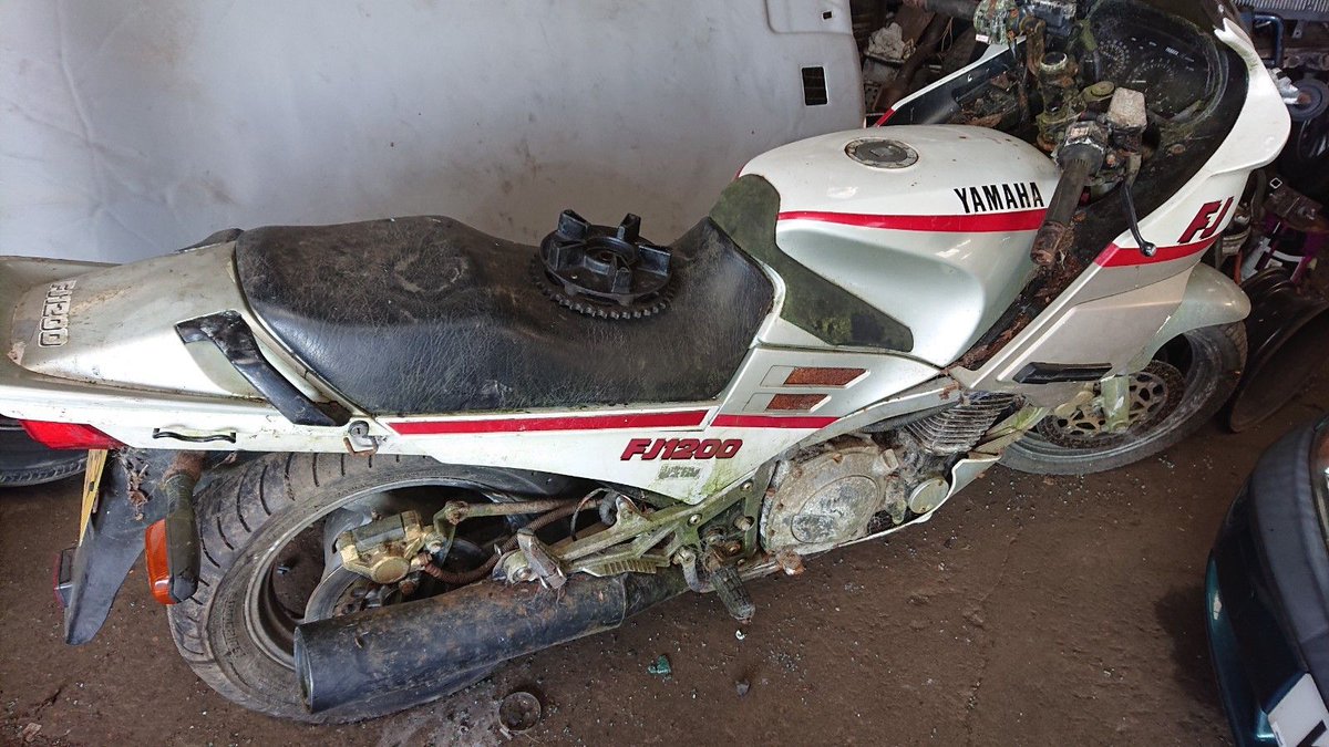 BarnfindMCycles's tweet photo. A genuine "garage find" Yamaha FJ1200 in need of restoration. This example looks a bit rough after standing unused for a long time, but the FJ line are tough as old boots and the engine should be solid if cared for. Ebay ad here https://t.co/r1unJ6aQi2 https://t.co/VI43xudmaj
