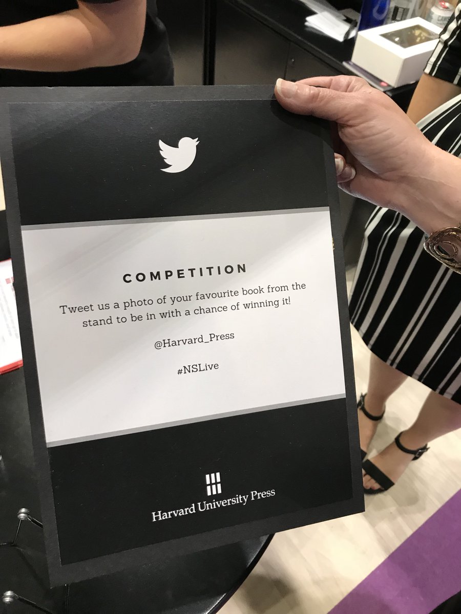 sign that says "Competition: tweet us a photo of your favourite book from the stand to be in with a chance of winning it @harvard_press #NSLive"