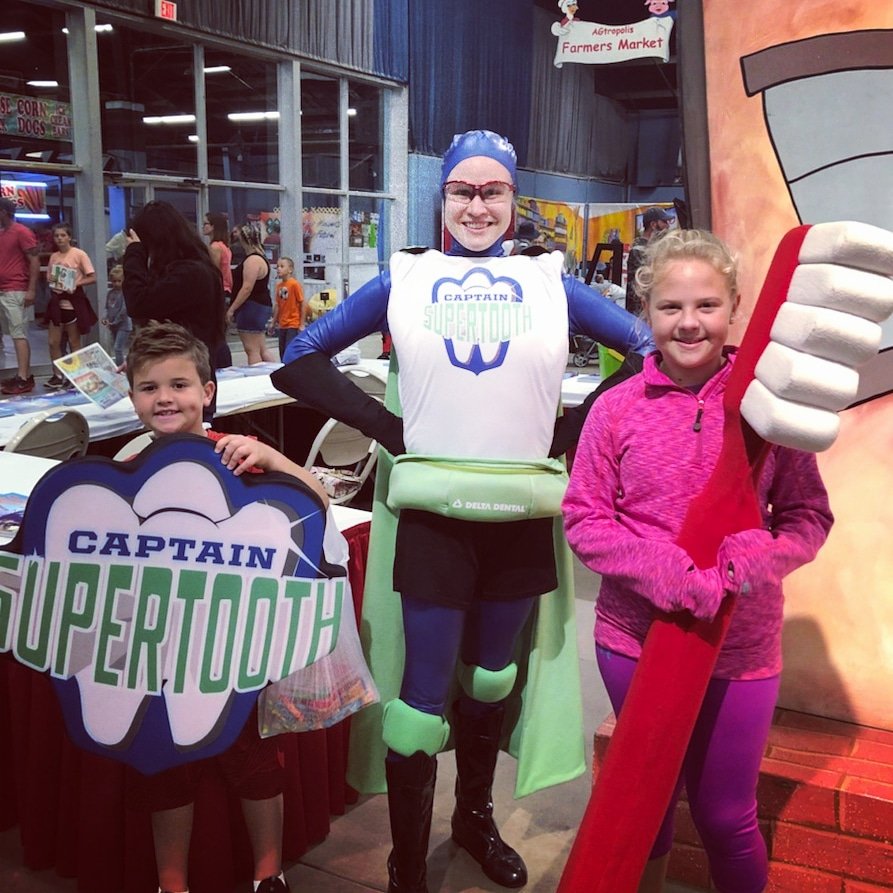DeltaDentalOK's tweet photo. Our #CaptainSuperTooth is enjoying the final weekend of the @okstatefair with some friends! #OKsmiles https://t.co/ufVaMX8lLe