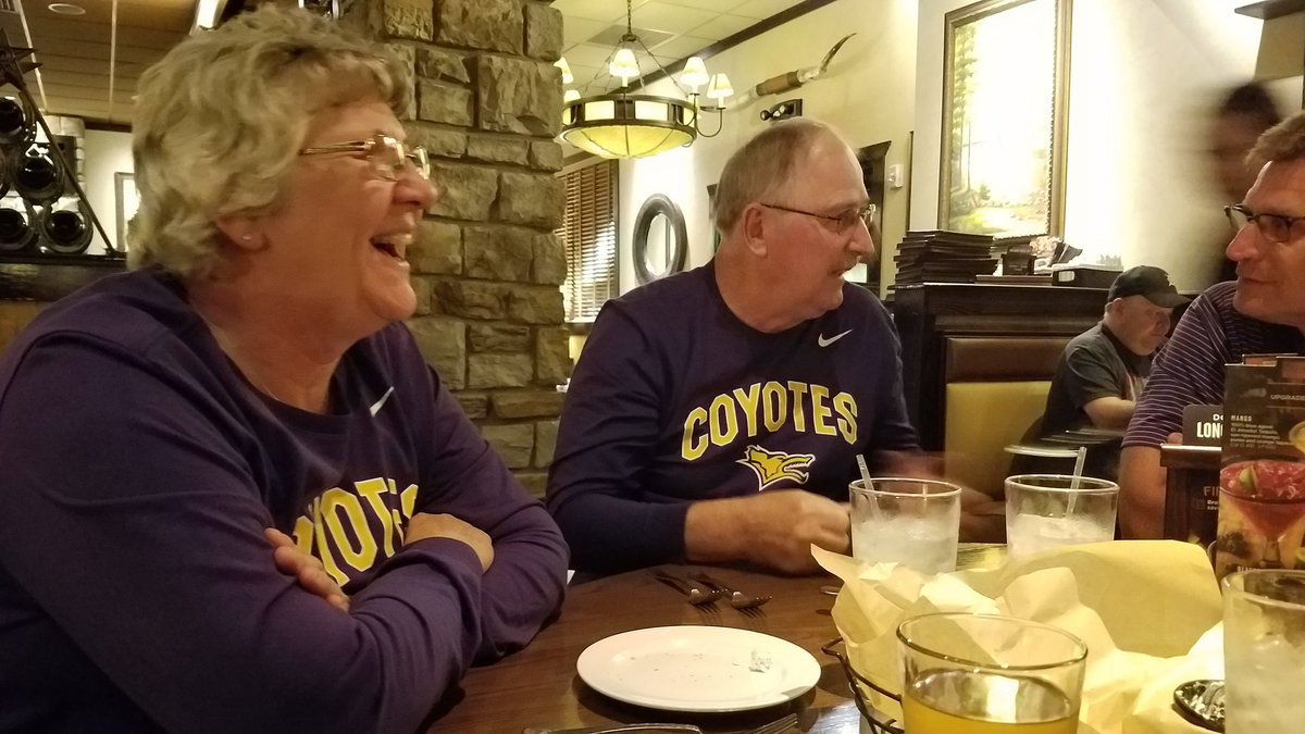 PatStrathman's tweet photo. Great to have my parents with @meganrobl's to take in a dominating win. Mom and dad were surprised with shirts and are now diehard @kwucoyotes fans! https://t.co/4K22ngsCDa