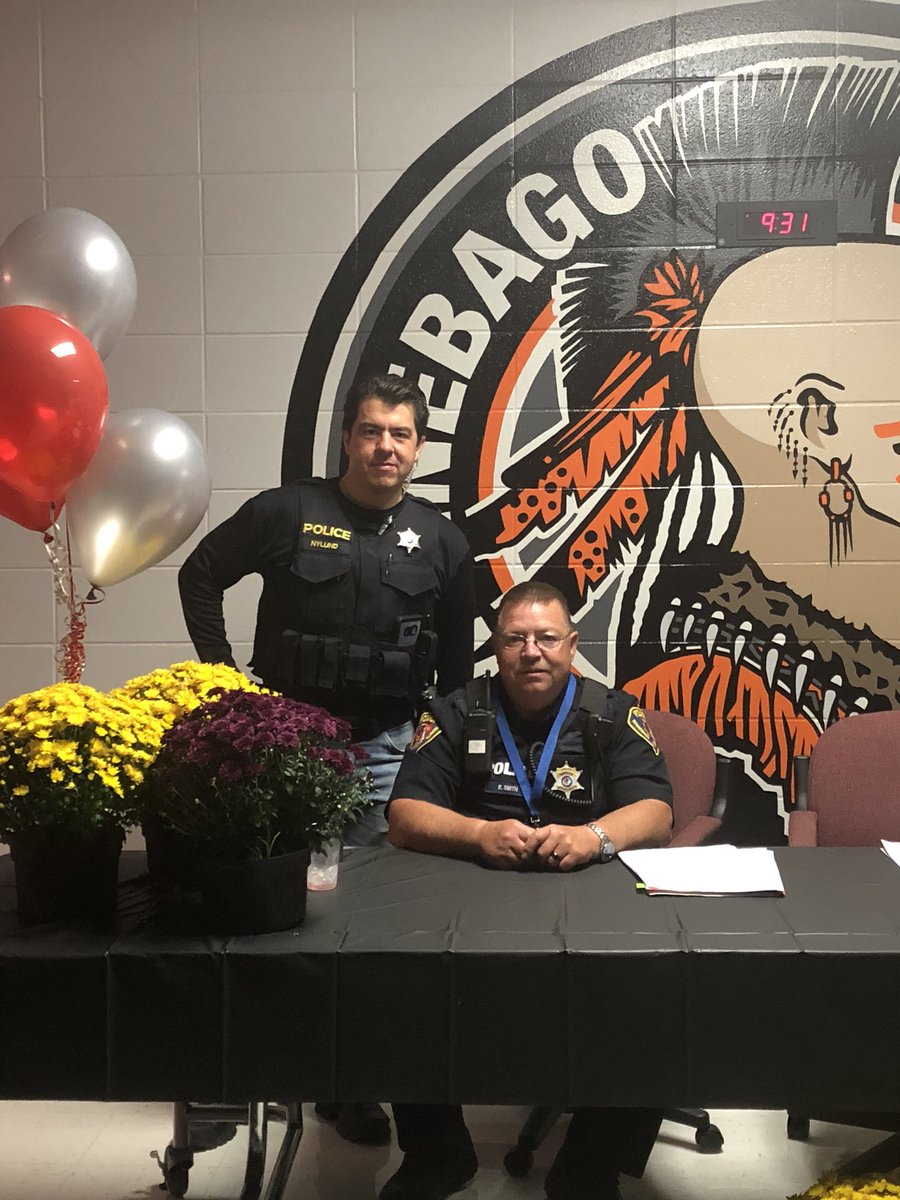WinnebagoPD's tweet photo. Officers Nylund and Smith keeping an eye on things over at @BagoHSPrincipal for the homecoming dance. #Homecoming2018 https://t.co/AqNIRwplKT