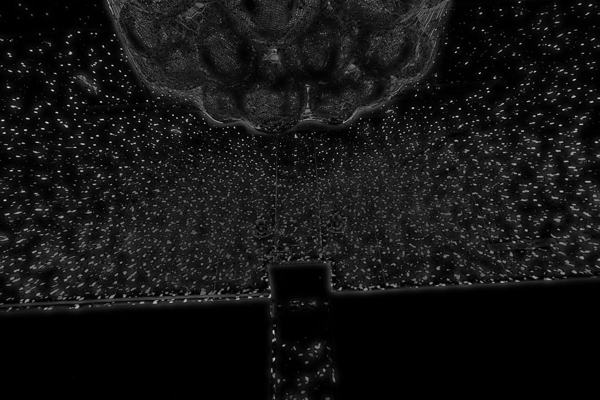 Debug image showing a room covered in reflections with disco balls hanging in a net from the ceiling.