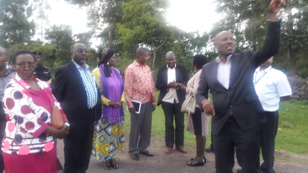 UgandaCAA's tweet photo. The Minister of @MoWT_Uganda Hon. Monica Azuba Ntege, with local leaders and CAA officials at Kisoro Airfield inspecting facilities and the alternative road for the community. She sensitized the community on the planned closure of the road currently crossing the runway. #CAAWorks https://t.co/9XIpNCSFpg