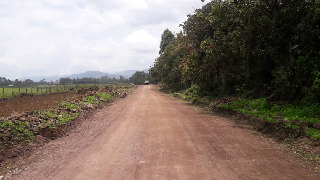 UgandaCAA's tweet photo. The Minister of @MoWT_Uganda Hon. Monica Azuba Ntege, with local leaders and CAA officials at Kisoro Airfield inspecting facilities and the alternative road for the community. She sensitized the community on the planned closure of the road currently crossing the runway. #CAAWorks https://t.co/9XIpNCSFpg