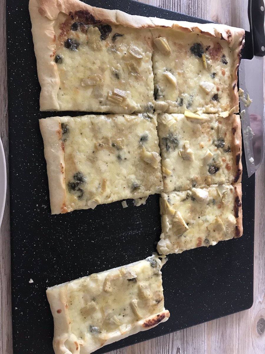 Homemade artichoke spinach pizza