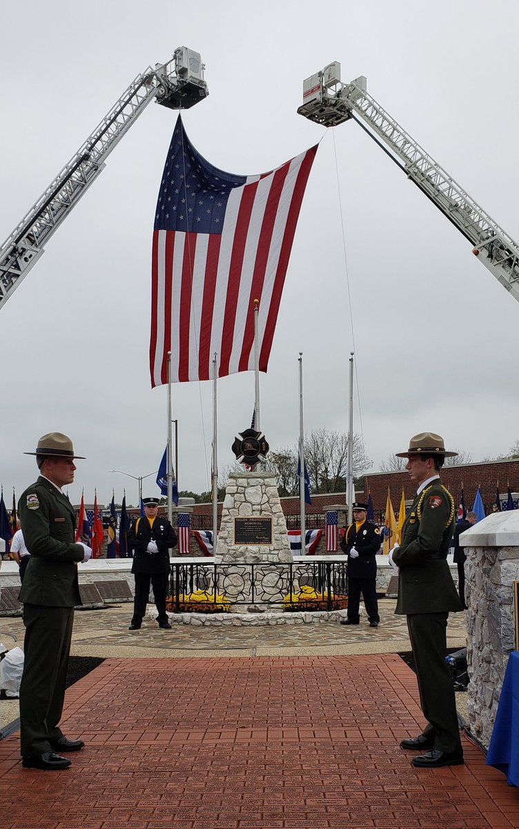 Flag being raised over the National Fallen Firefighters Memorial. Honor guard stands watch throughout the events. #FireHero2018