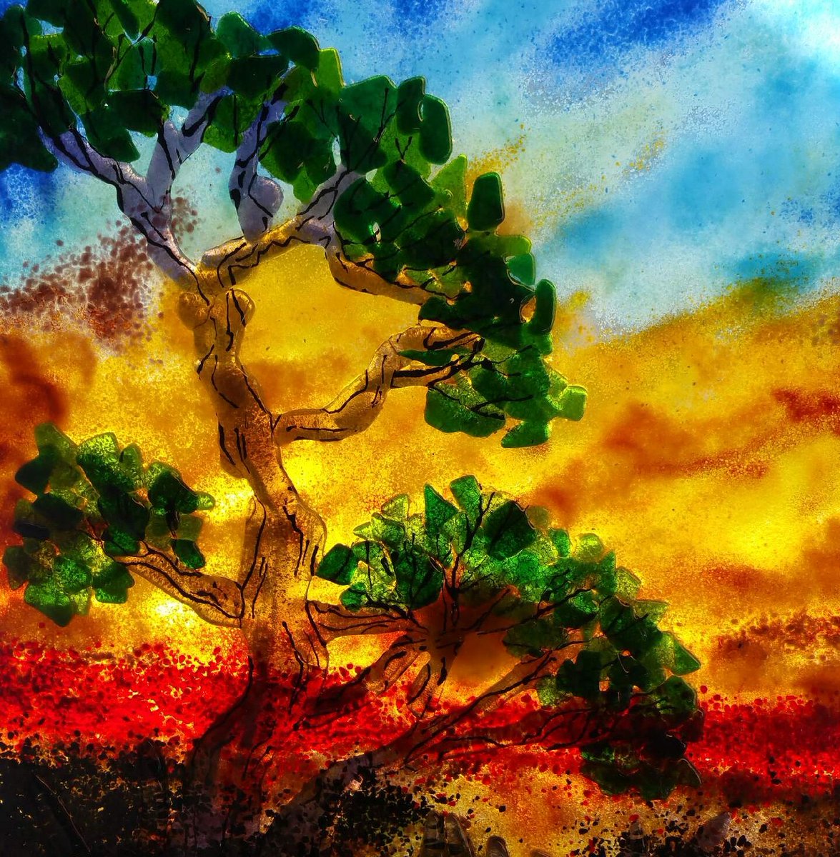 GlassLizardArt's tweet photo. This fused glass piece is 23 x 26 inches. Its background was in the kiln three times for firing, while the tree was in the kiln two times on its own. Then, the two were fused together for the final piece. #fusedglass #artist https://t.co/e0ByUyhLDr