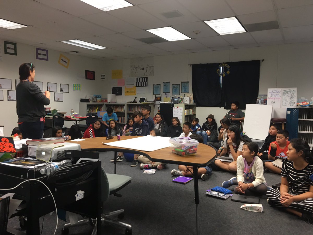 JellickBuck's tweet photo. Thanks @MsTracyDo for sharing examples about character analysis in literary essays for #WritersWorkshop. We appreciate how you interact with all of us. 😊 Can YOU spot our @JellickJaguar #TerrificTOSA? #WheresMsDo? #WeAreRUSD https://t.co/CzitGzgAOg