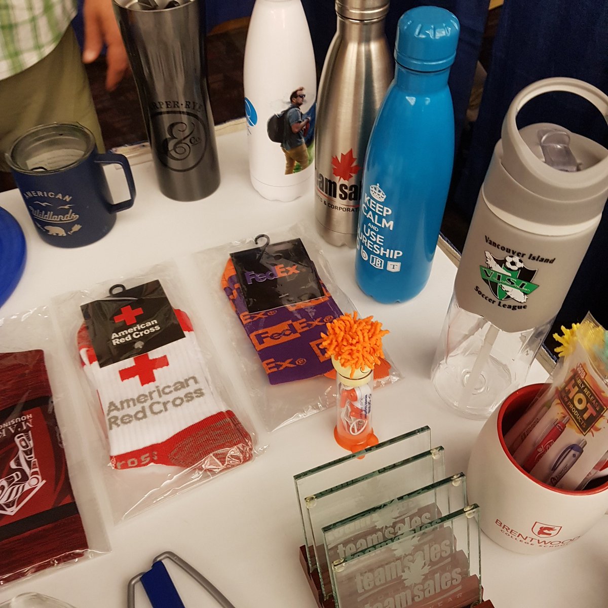 VictoriaMarathn's tweet photo. Come visit Bill at the @TeamSalesVic booth and check out all the great custom #swag that they can make for you, from caps to water bottles to socks and much more https://t.co/1Xx66iM2Hf