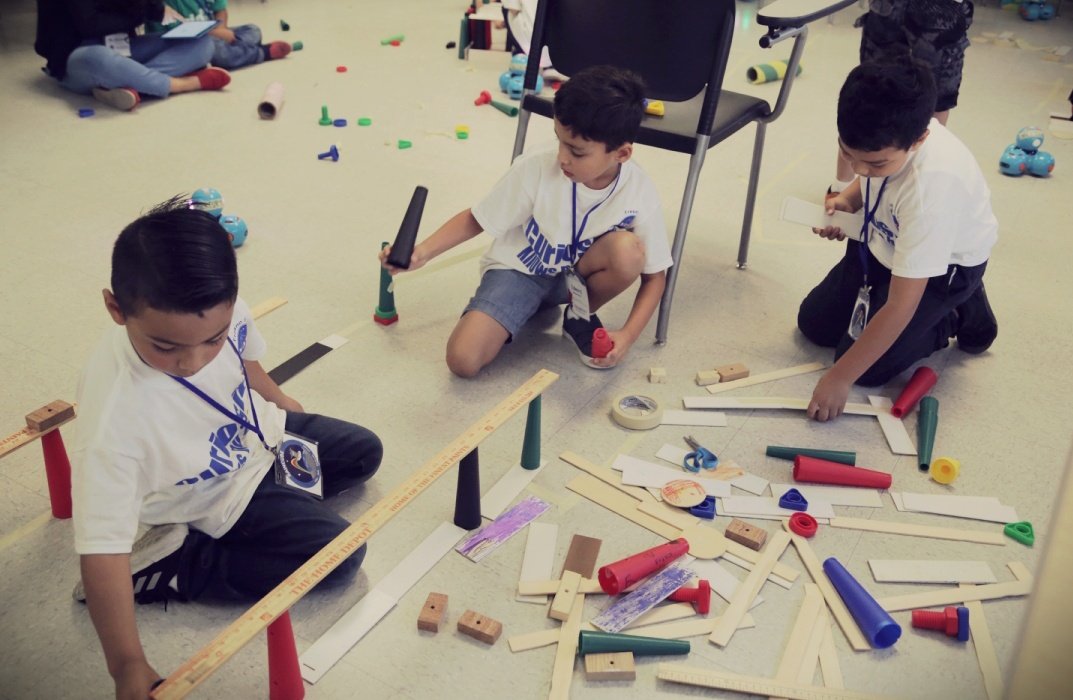 Dash Robotics students are tinkering their maze for their robot to travel through.
