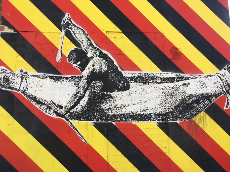 Deathscapes's tweet photo. "Welcome to Redfern’ concept art by Reko Rennie, Redfern Terrace Street Art Project based on engraving ‘Pimbloy: Native of New Holland in a canoe of that country’ 1804 by Samuel John Neele. Villawood: A Suburban #Deathscape in Plain Sight https://t.co/CqcAewFZUz https://t.co/KNTSWrUC9W