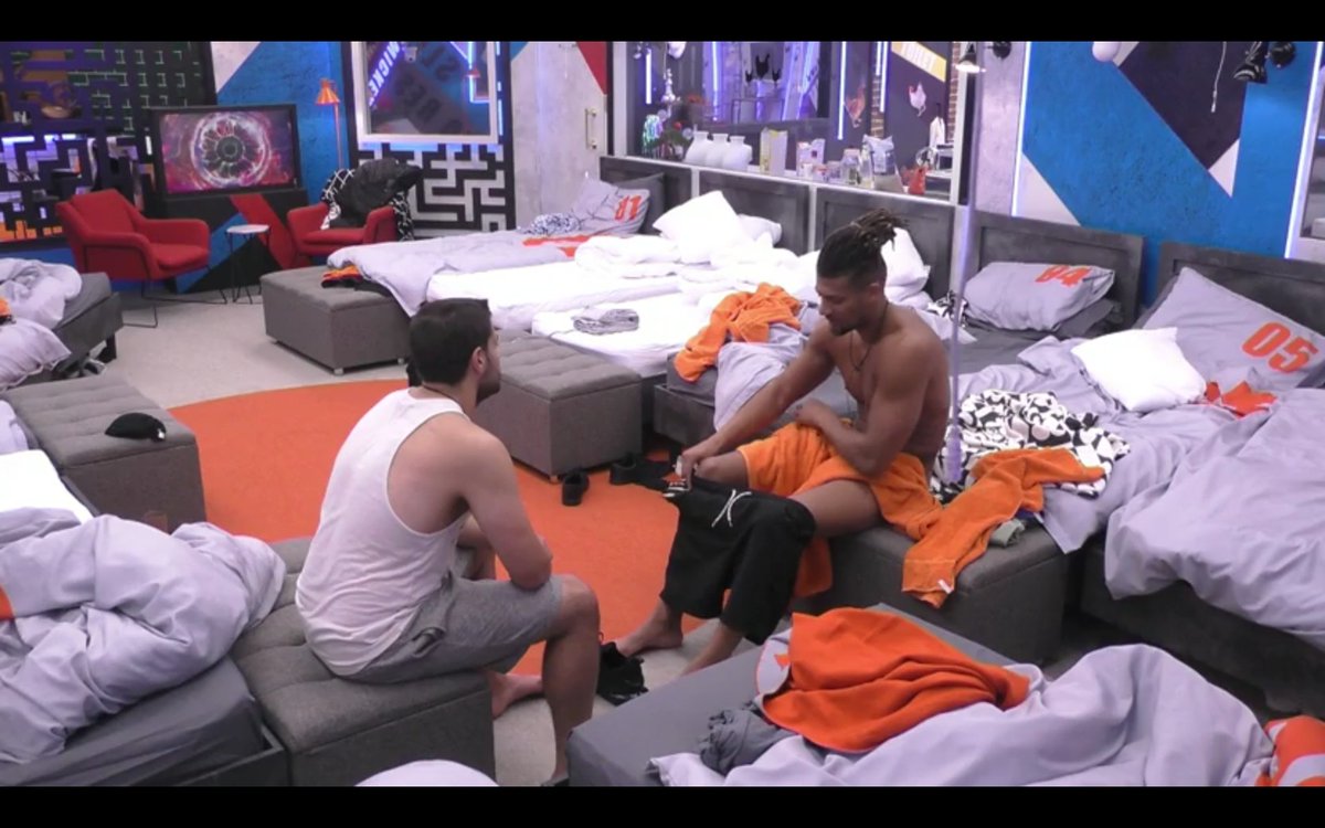 CelebWanker's tweet photo. Did anyone else love the moment @isaacjag was getting changed while chatting to @rhondda_the? We loved the flash of arse crack at the end, but we'd have loved it even more if #BBIsaac has flashed what was underneath that orange towel. #Isaac #BBUK https://t.co/hA3AnbnJcM