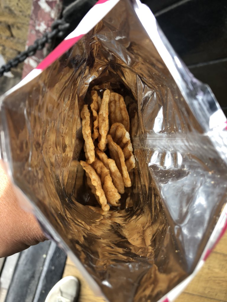 scamscour's tweet photo. Two culprits of frivolous waste and shameful hoodwinking of consumers: @popchips @popchipsUK @eatshoreditch. 

A pathetic amount of product for each pack’s size - lighter weight than advertised, appalling packaging waste, non-recycle materials. @lizbonnin #DrowningInPlastic https://t.co/SX9JMB1X94