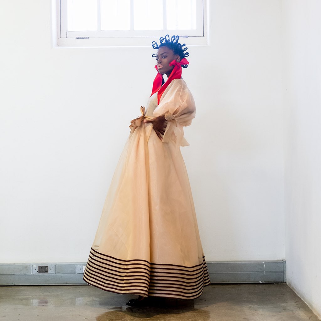 Traditional isiXhosa I motifs were modernized with pops of colourful accessories - <a href="/TsotetsiKL/">Tsotetsi KL</a> at #AFIJFW