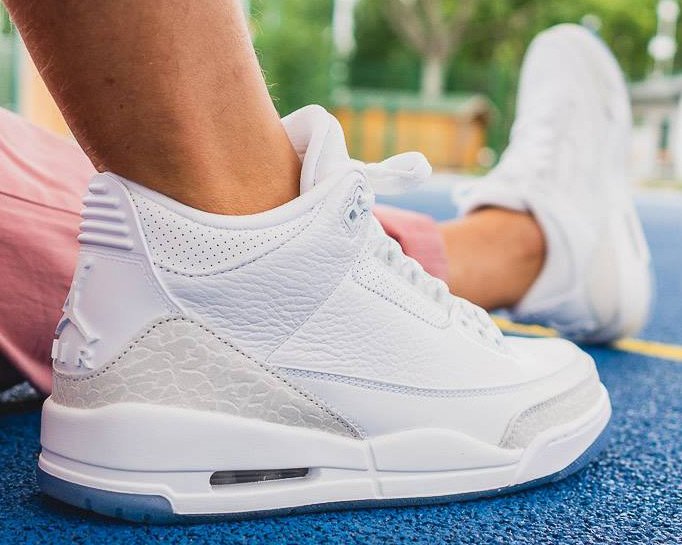 triple white 3s on feet