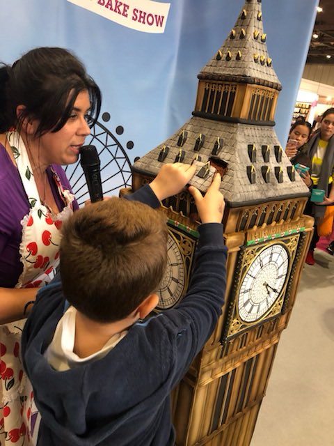 CakeandBakeShow's tweet photo. And thatโs it for another year! @RosieCakeDiva cut her incredible Big Ben showstopper to close the show - thank you all for coming and weโll see you next year... happy baking! #CakeBake18 https://t.co/rVRKCejUqN