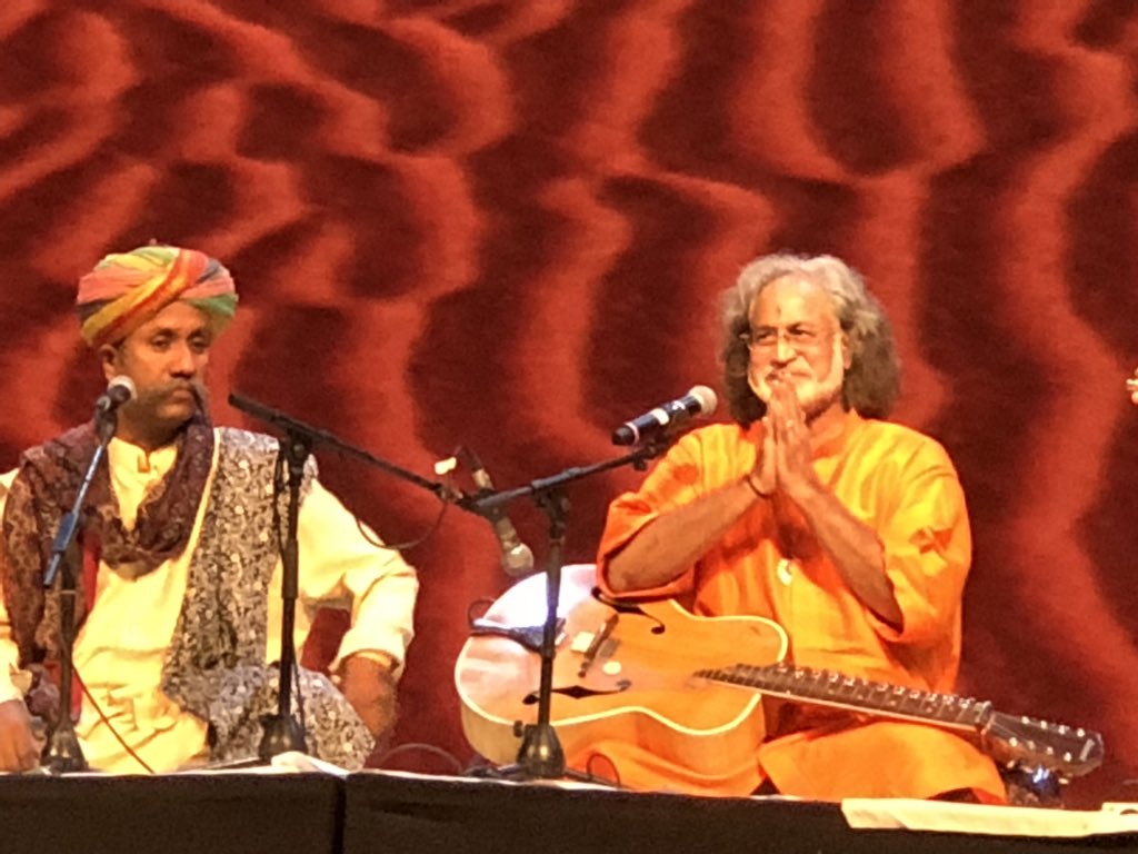 AbhijitBhaduri's tweet photo. Pt Vishwa Mohan Bhatt mesmerizes with a bouquet of Raga Des, Kirwani and Bageshree. Anwar Khan’s unrestrained vocals are a treat. Brilliant fusion of folk and classical #PaddyFields18 https://t.co/fNA8jqYEwd