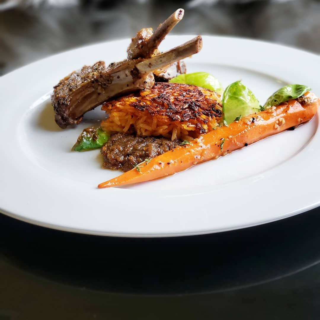 Crispy Jollof Rice | Lamb Confit | Baby Carrot Confit •
•
by @chef.kess@kesskravings @savorkravings  @jenesiscafe @kesskravingsspice #ContemporaryAfrica