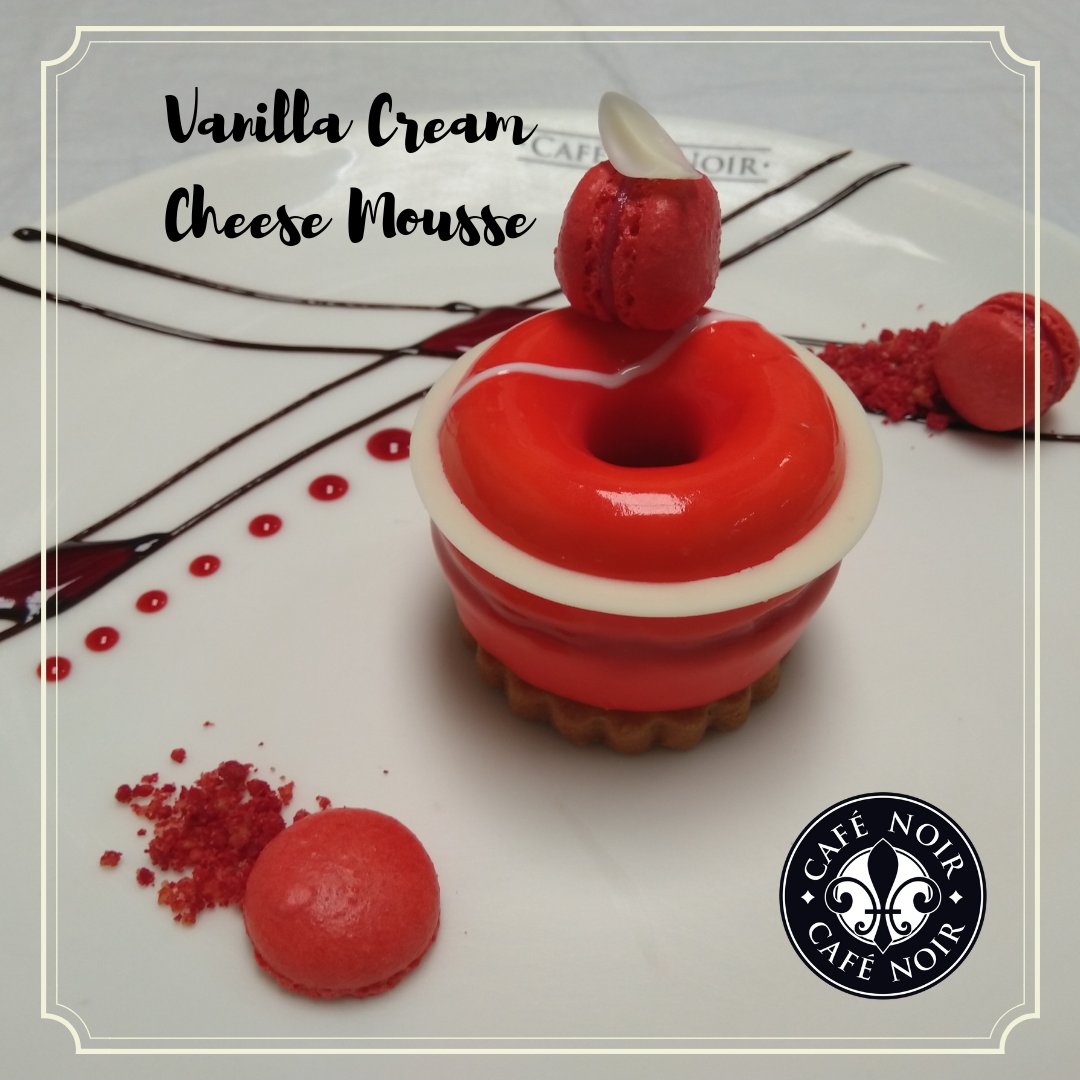 CafeNoir_India's tweet photo. Introducing our new Signature dessert - Vanilla Cream Cheese Mousse - with raspberry jelly placed on a crispy butter biscuits, served with raspberry coulis and baby macarons. Bon Appétit! https://t.co/blO7dxdXfe