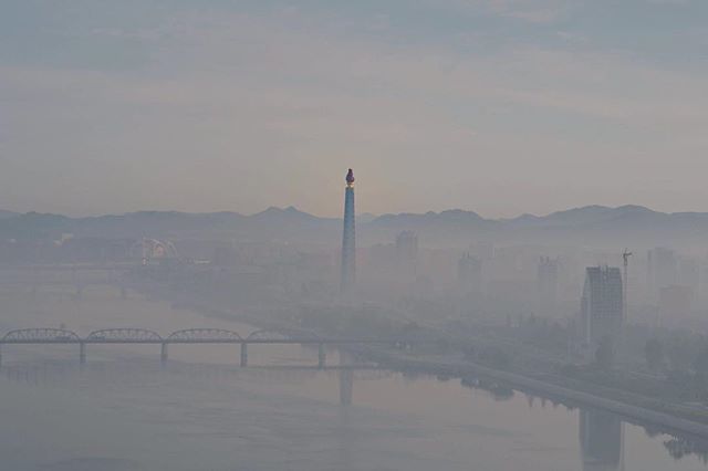 classetouriste's tweet photo. I’m taking a pre production Nikon Z7 for a test drive in North Korea and shot this early morning sunrise from my room of the Yanggakdo hotel overlooking a misty Pyongyang. You can spot the Mayday stadium in the distance where the Mass Games are happening… https://t.co/tMpjWe9kpq https://t.co/sWSLKDqAMX