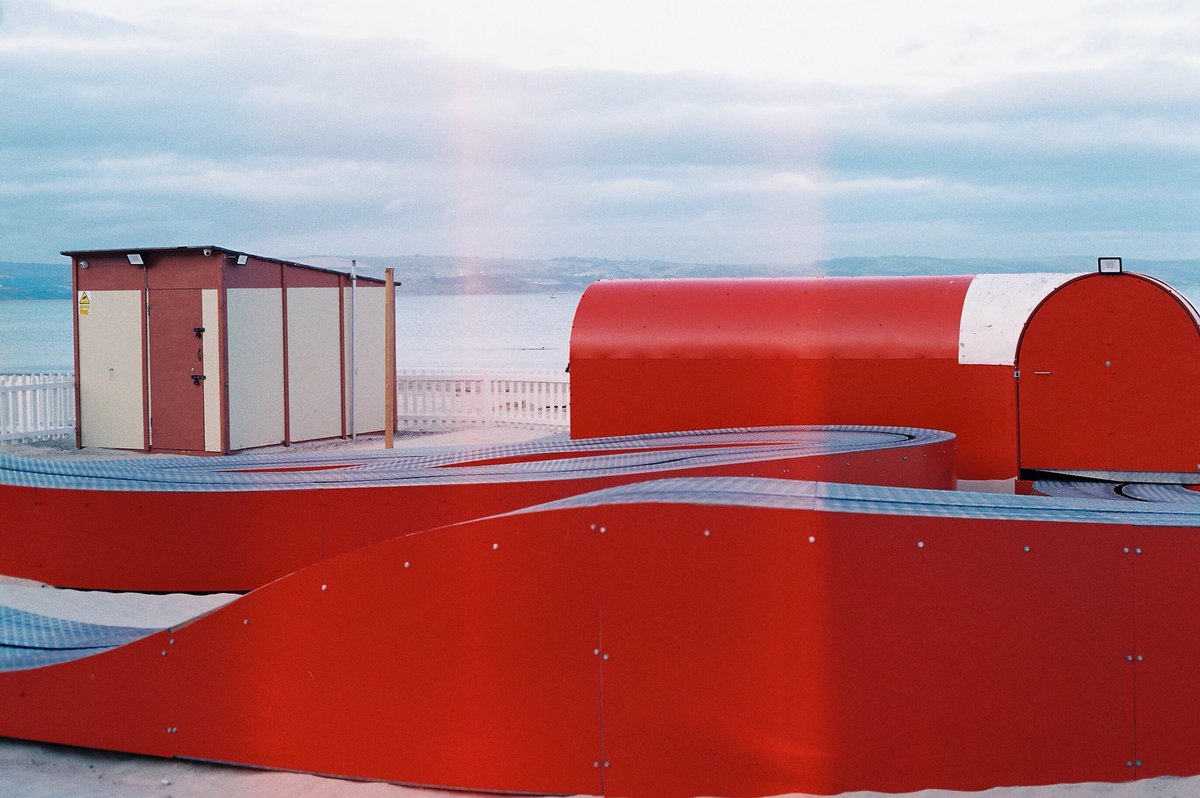 STUDIOGRABDOWN's tweet photo. When you’re feeling at your worst, @STUDIOGRABDOWN can recommend an off-season weekend trip to one of the U.K’s many sea side towns to make things seem even more terrible. Weymouth beach carriage ride, CLOSED for the winter, 2018, 35MM #believeinfilm https://t.co/C2ZCUj2KN9
