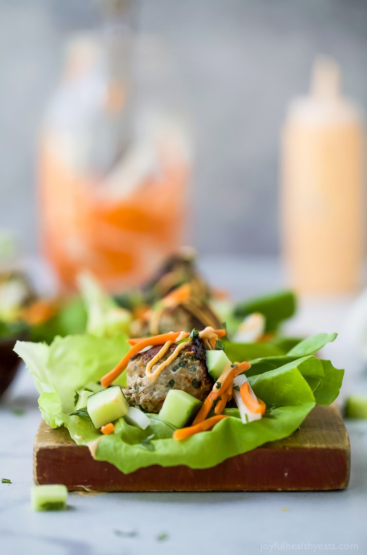 Quick Easy Banh Mi Lettuce Wraps a healthy low carb version of the famous Banh Mi Sandwich! Asian inspired turkey meatballs served on a lettuce wrap with pickled vegetables and sriracha mayo! It's dinner perfection! joyfulhealthyeats.com/healthy-banh-m… #glutenfree