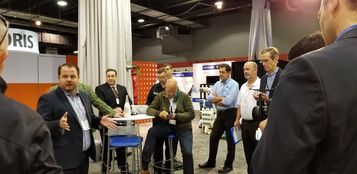 PrintMediaCentr's tweet photo. Kevin Abergel @MGI_USA shows a group of eager press at #labelexpo the WORLD'S FIRST embossed shrink wrap label. Congrats Team MGI and @KonicaMinoltaUS. #design #packagedesign #labels #LabelLover #LabelLovers https://t.co/15EA4Sv82E
