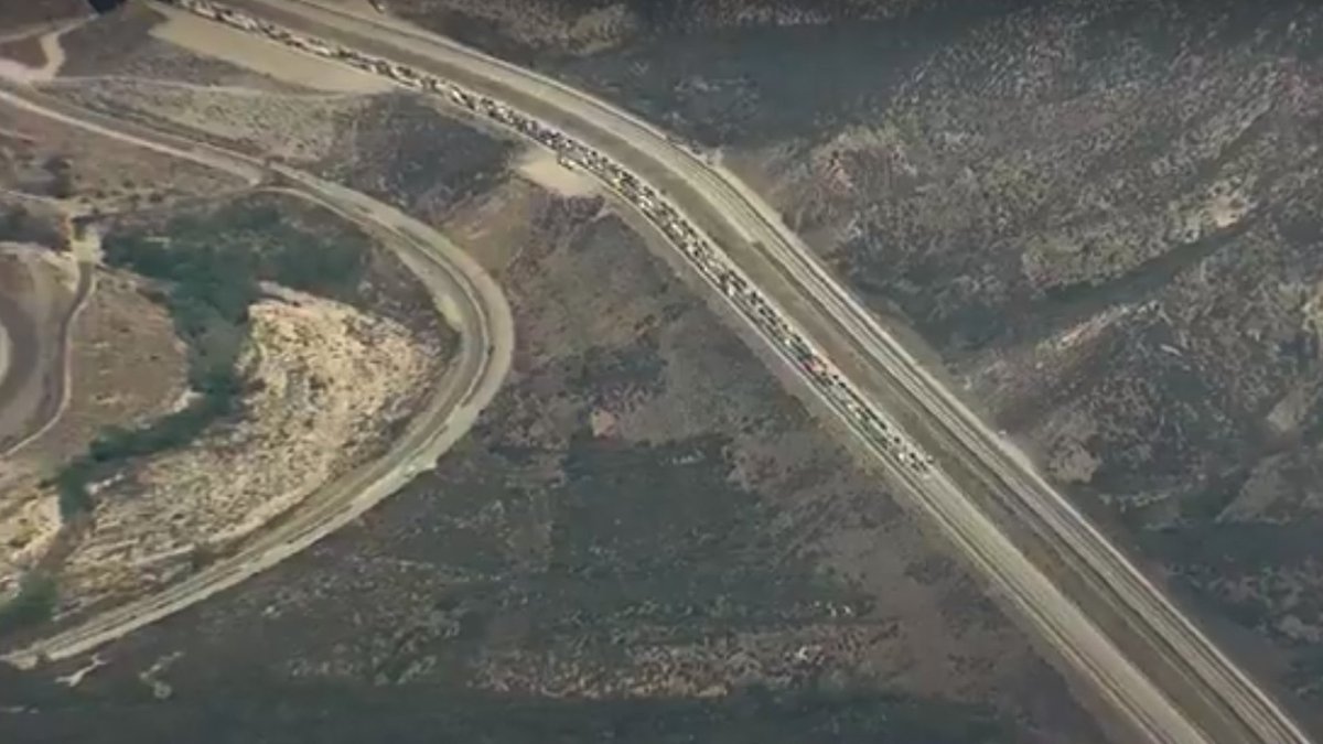 KTLA's tweet image. Traffic along the 15 Freeway is backed up for miles as smoke from the #KeenbrookFire dissipates on.ktla.com/KT3vQ