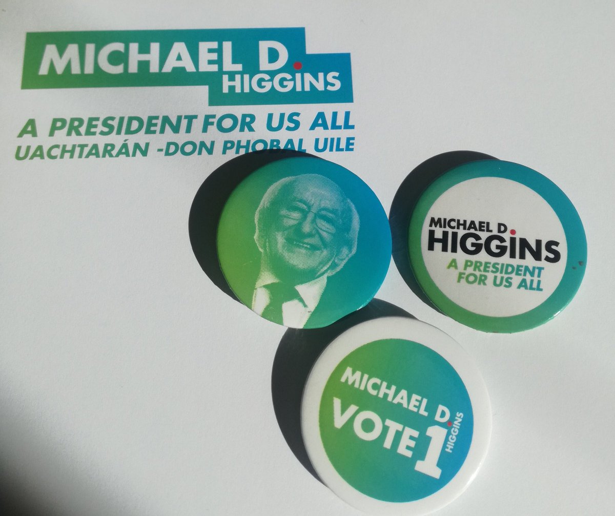 Three blue and green campaign badges on white headed paper