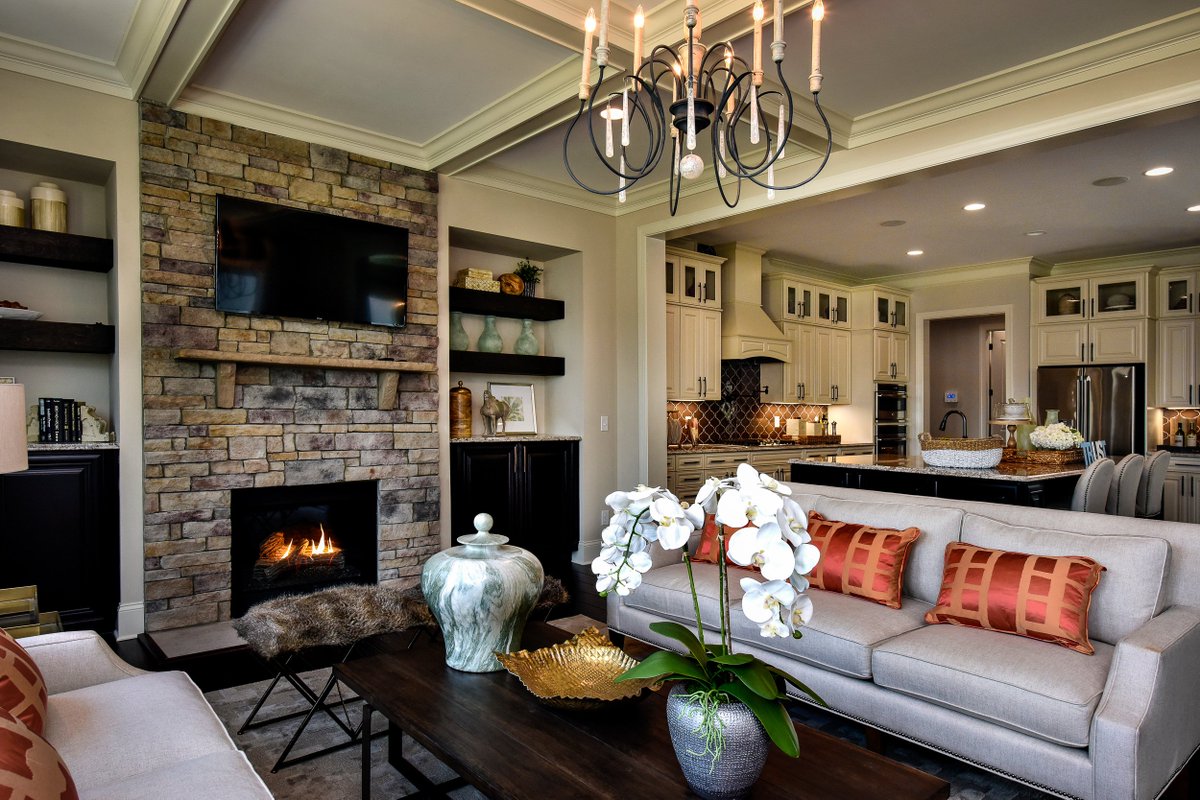 Come home to #stylish #living… bit.ly/2hOWbgb. #gathering #livingroom #newhome #stonefireplace #fireplace #raleigh #nc #realestate #realestateagent