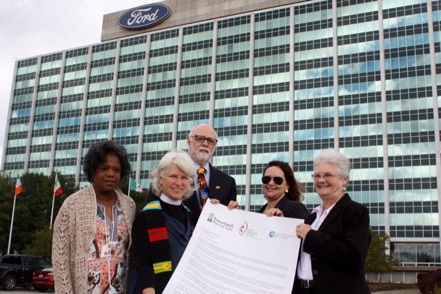 interfaithpower's tweet photo. Faith leaders deliver 12-foot long petition signed by thousands to @Ford HQ today to urge the company to stand by #cleanercars standards, say it is unconscionable to renege on them now #FaithtoFord ⁦@SierraClub⁩ ⁦@MichiganIPL⁩ https://t.co/gGmToMxr60