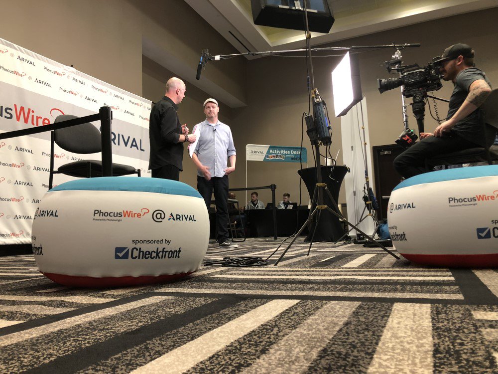 Checkfront's tweet photo. We are so happy to sponsor the @phocuswire @ #Arival Video Lounge. Our CEO, @jasonmorehouse, got to speak with @kevinlukemay about the industry and the @arivalevent experience. The event has been a great success and we are proud to be an overall Launch Partner of #arival2018! https://t.co/KhRvEyHeyx