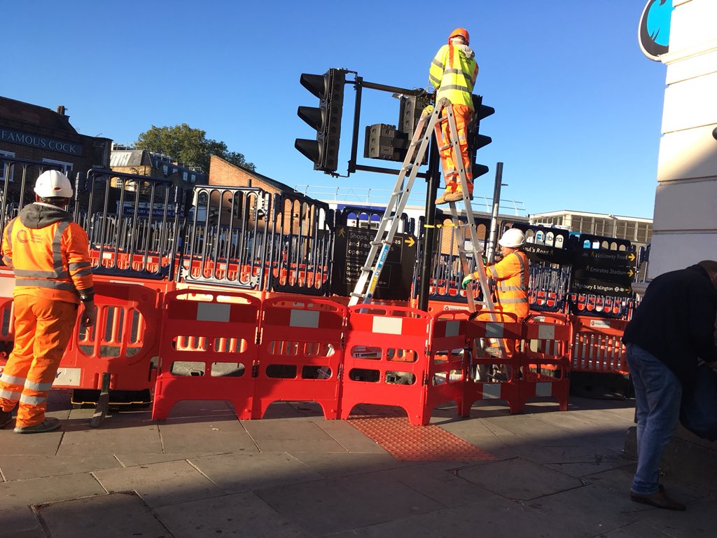 FieldsHighbury's tweet photo. Progress on restoring the much-needed pedestrian crossing by Highbury and Islington station. And thanks to the Romanian engineers, fellow EU citizens, putting up the traffic lights. 🚦 https://t.co/9d3iM1O4Zb